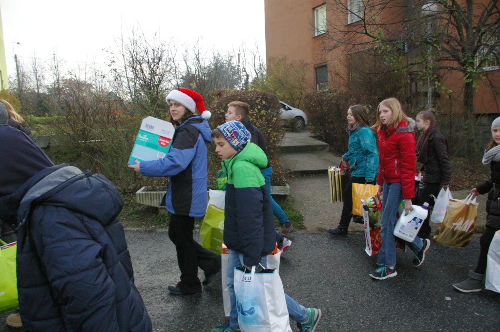 Children from the International Christian School in Budapest deliver presents that they collected